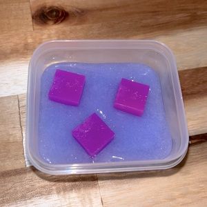 Lovely lavender slime comes with container and a thank you note, with accessory.